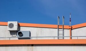Commercial rooftop HVAC equipment and parapet walls requiring elevation survey planning for a new equipment pad